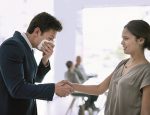 Man coughing into tissue, ill, shaking hands with woman